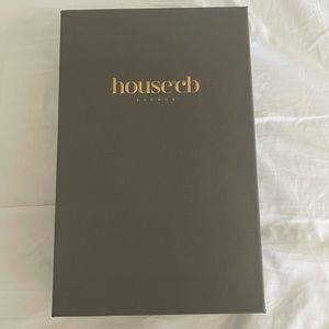 Black and feathered strapless dress